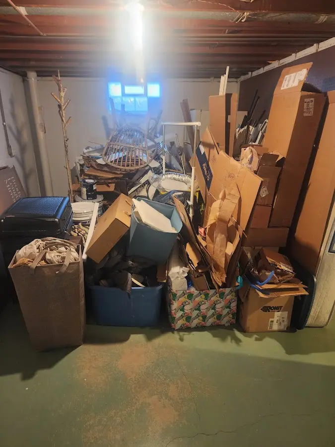 Roll-off dumpster container at job site for 2 Yard Dumpster Rental in Pine